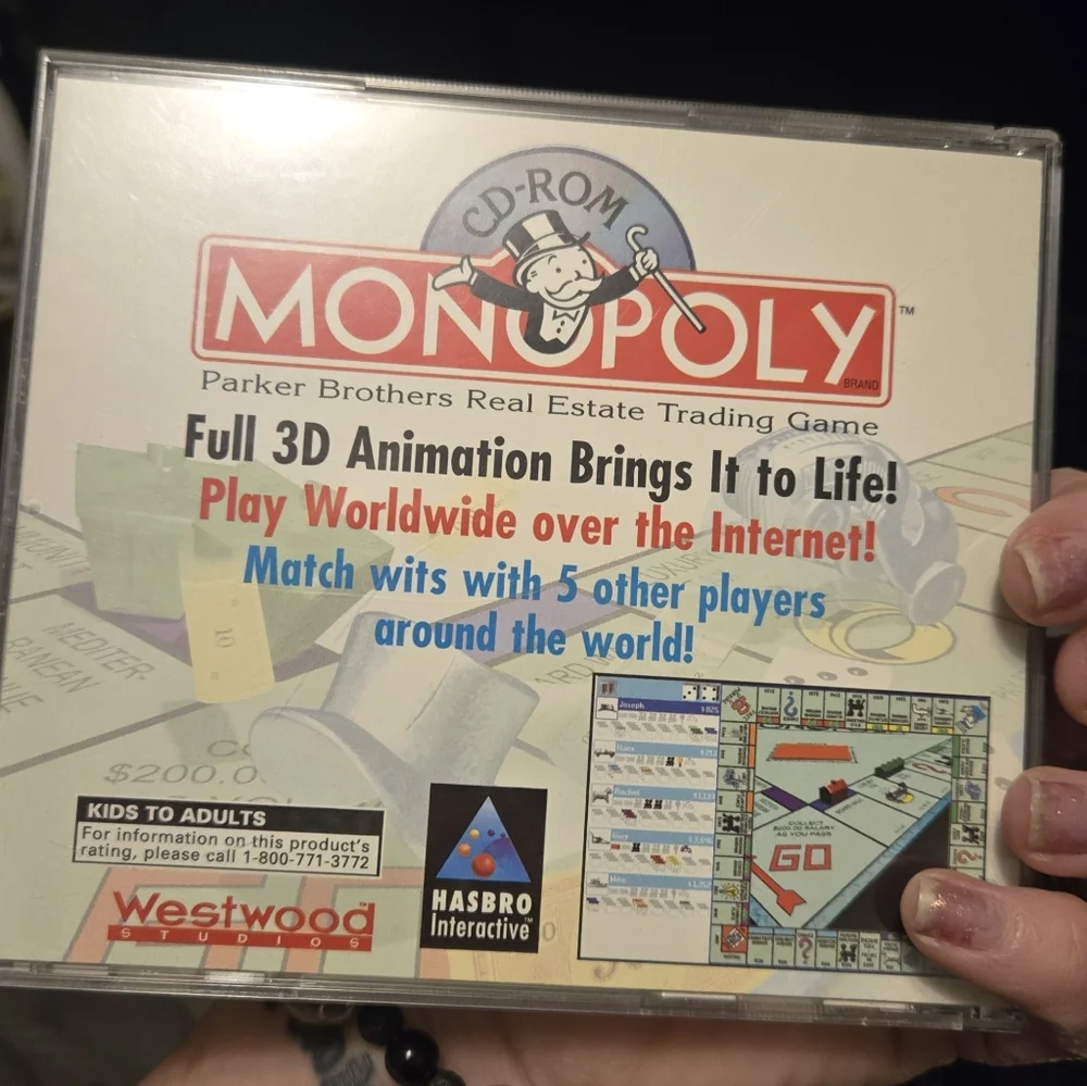 Hasbro Monopoly CD-ROM Game with Red and Blue Accents